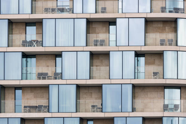 istock Facade modern building along river Thames in London, England 831159988