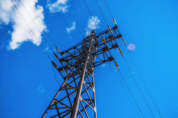 istock Supports high-voltage power lines against the blue sky. 831168062