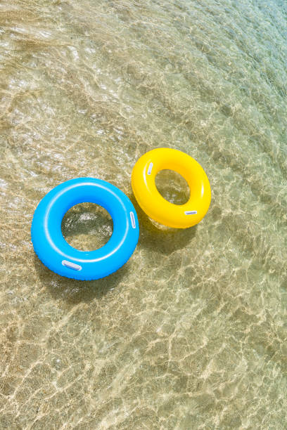 istock rubber rings floating on the clear sea, Pedn Vounder beach, Cornwall. 831173840