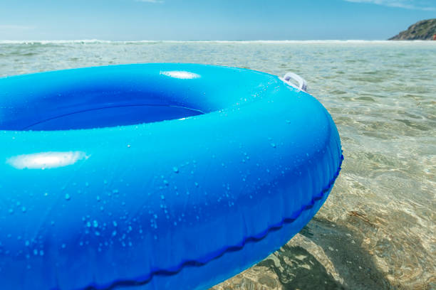 istock rubber rings floating on the clear sea, Pedn Vounder beach, Cornwall. 831173860