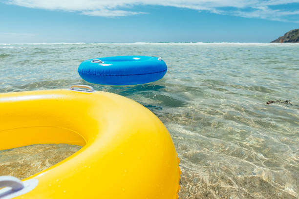 istock rubber rings floating on the clear sea, Pedn Vounder beach, Cornwall. 831173884