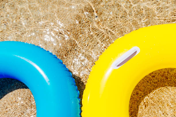istock rubber rings floating on the clear sea, Pedn Vounder beach, Cornwall. 831173916