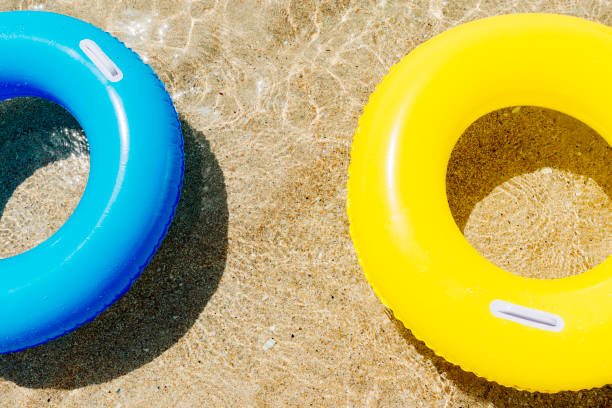 istock rubber rings floating on the clear sea, Pedn Vounder beach, Cornwall. 831173924