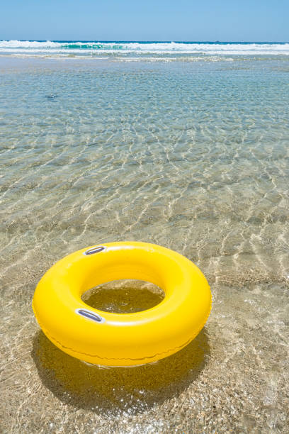 istock Yellow rubber ring at Pedn Vounder Beach, Cornwall 831173966