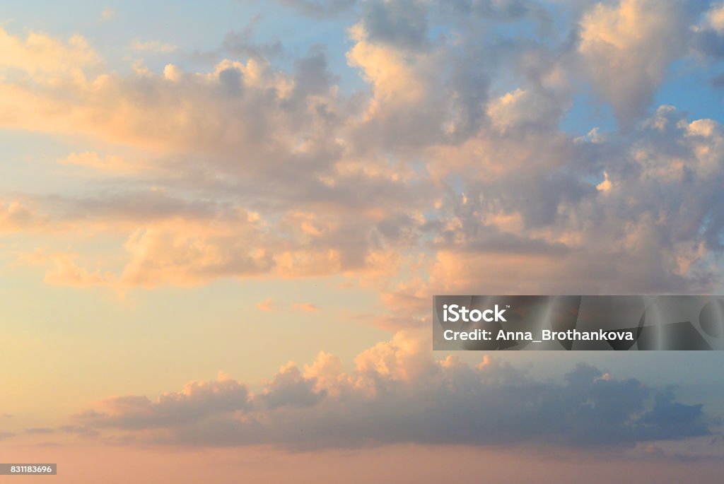 Fiery orange sunset sky. Beautiful clouds. Romantic sunset sky. Beautiful fiery cumulus clouds before twilight Sky Stock Photo