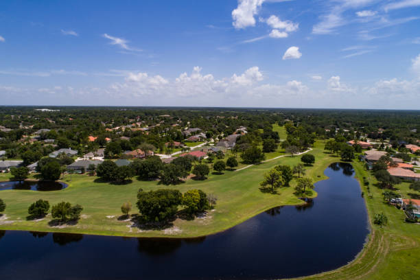 istock Golf course in a golf community with a oddly shaped lake. 831186448