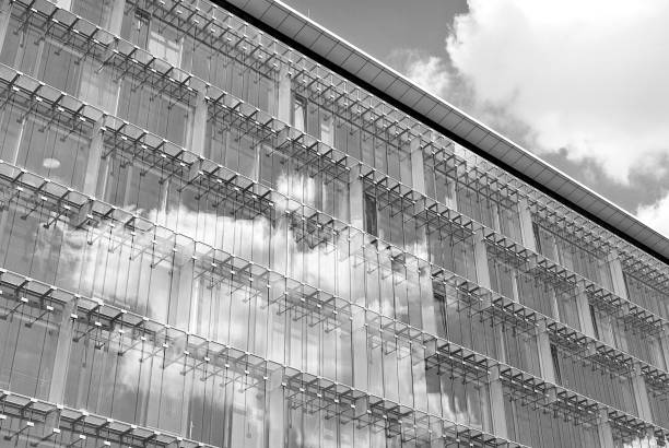 istock Modern building.Modern office building with facade of glass.Black and white. 831190812
