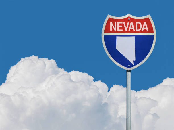 istock Highway sign for Interstate road in Nevada with map in front of clouds 831196692