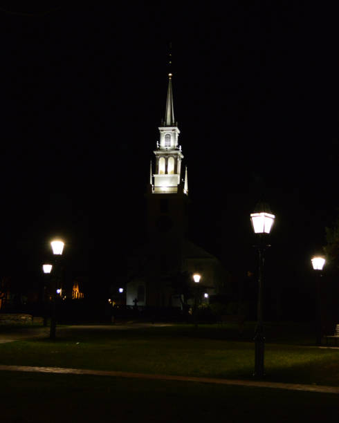 The Trinity Church in Newport Rhode Island at night looking out over Queen Anne Square.