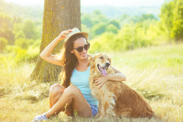 istock Young woman having a fun with her dog 831209964