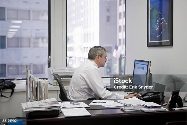 Man In Office Using Computer Stock Photo - Download Image Now - Desk, Office, Picture Frame