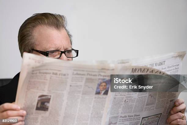 Man Reading Newspaper Stock Photo - Download Image Now - 60-64 Years, Active Seniors, Adults Only