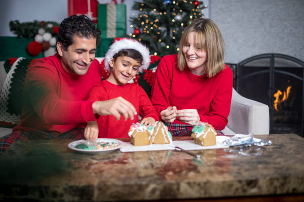 istock Family Making Gingerbread House 831219094