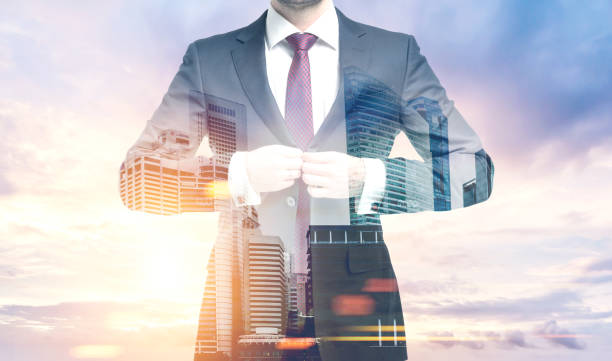 istock Man buttoning a suit in a morning city 831223160