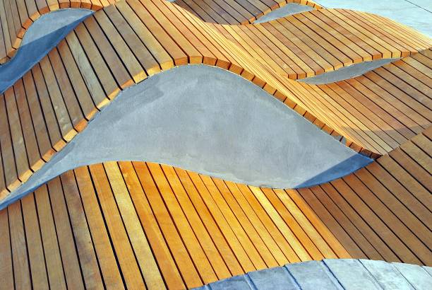 istock Modern curved s shaped brown wooden bench 831230100