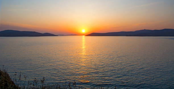 istock beautiful fiery sunset over the sea 831233512