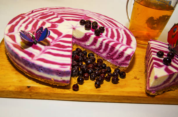 istock beautiful bright cake with currants, white with purple cake adorned with berries, 831235958