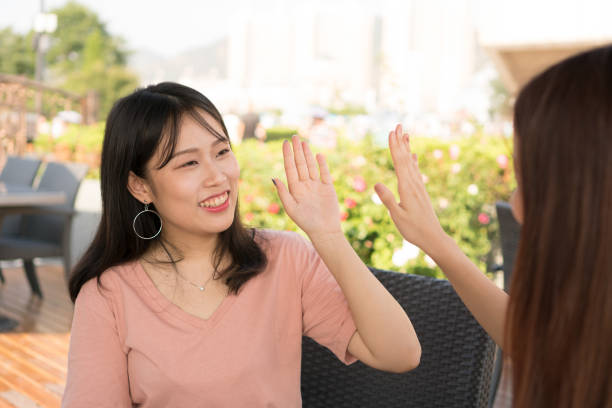 istock tow girls  high five 831236364