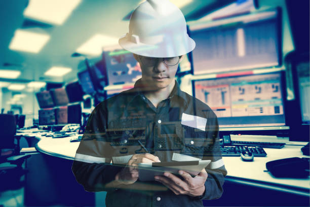 istock Double exposure of  Engineer or Technician man in working shirt  working with tablet in control room of oil and gas platform or plant industrial for monitor process, business and industry concept. 831242074
