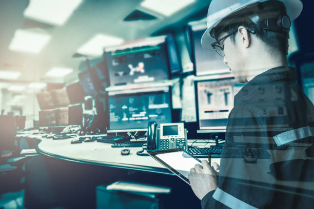 istock Double exposure of  Engineer or Technician man in working shirt  working with tablet in control room of oil and gas platform or plant industrial for monitor process, business and industry concept 831242102