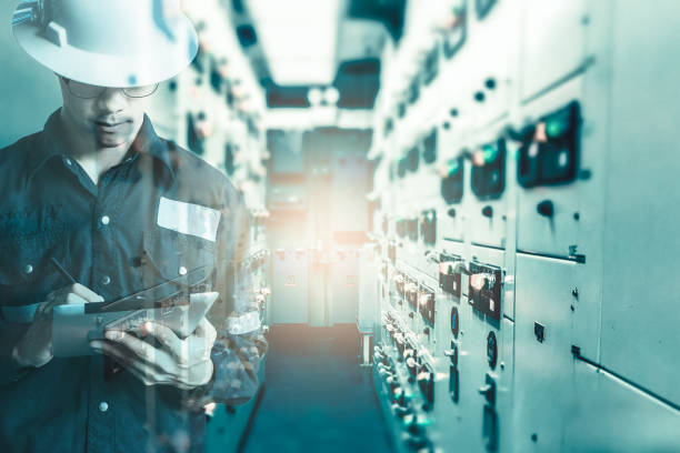 istock Double exposure of  Engineer or Technician man in working shirt  working with tablet in switch gear electrical room of oil and gas platform or plant industrial for monitor process, business and industry concept 831242106