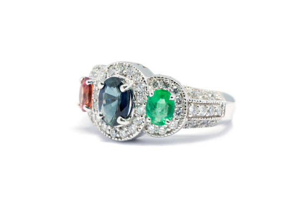istock Closed up Emerald, Blue Sapphire and Pink Diamond with white diamond and Platinum ring 831252050