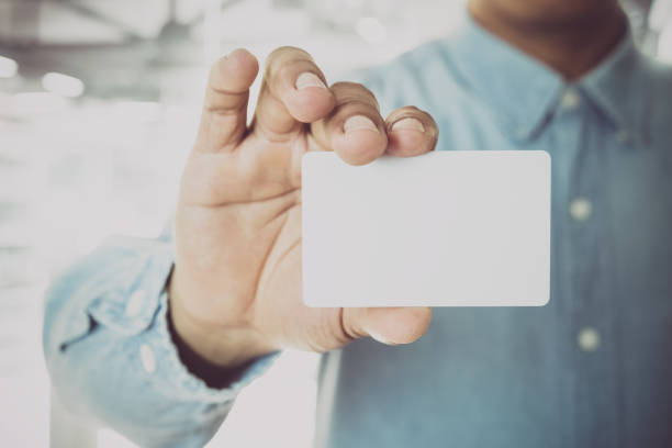 istock Businessman with business card 831257674