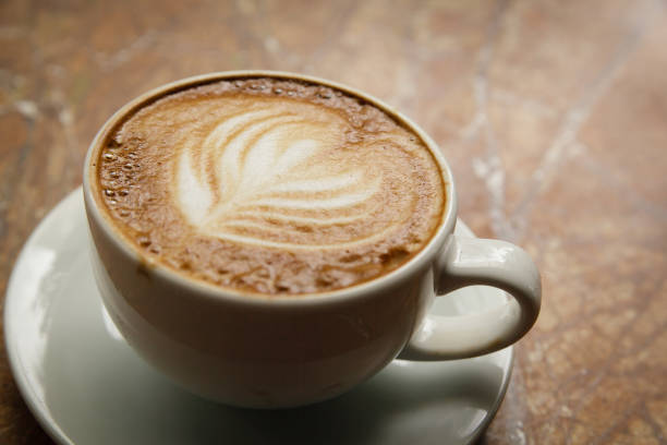 istock Espresso macchiato with latte art on a marble counter 831263714