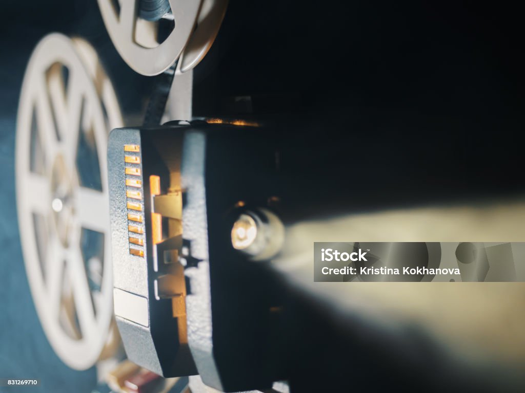 film projector on a black background with dramatic lighting and selective focus Movie Stock Photo