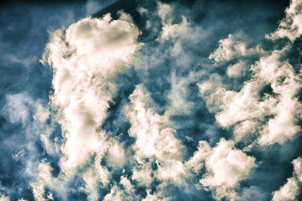 Blue sky with many fluffy white clouds close up