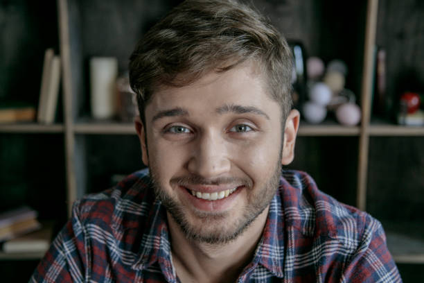 istock Happy man portrait. Young man smiling in beautiful creative and cozy workshop 831287894