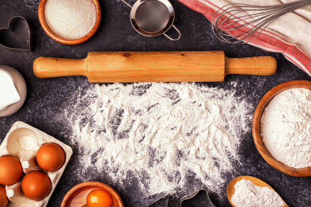istock Ingredients for baking  - flour, wooden spoon, rolling pin, eggs. 831292474