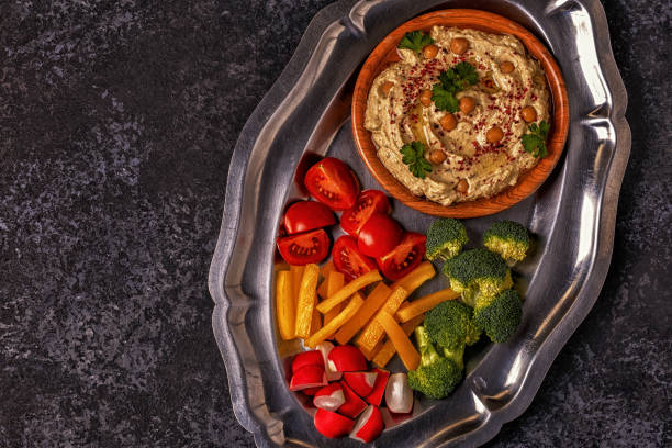 istock Classic hummus with vegetables on the plate and pita bread. 831292714