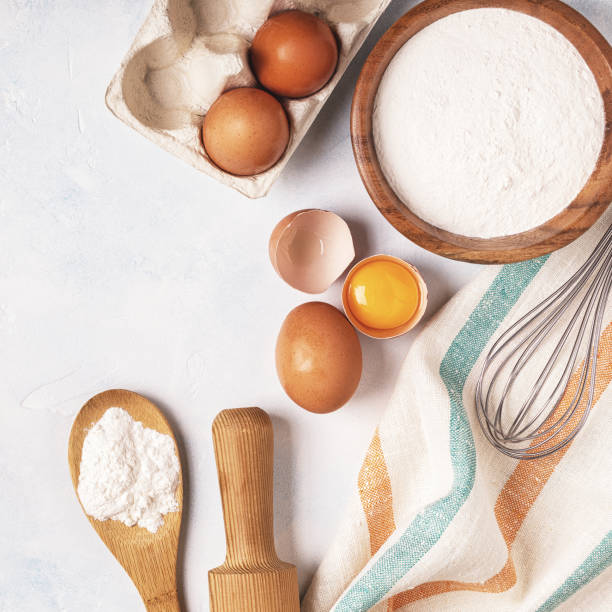 istock Ingredients for baking  - flour, wooden spoon, rolling pin, eggs. 831294326