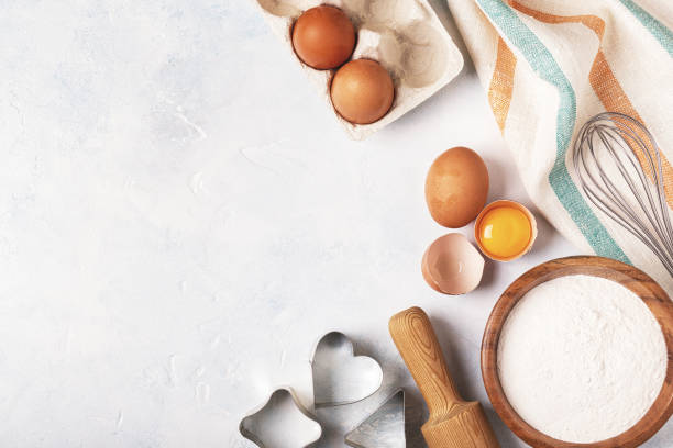 istock Ingredients for baking  - flour, wooden spoon, rolling pin, eggs. 831294742