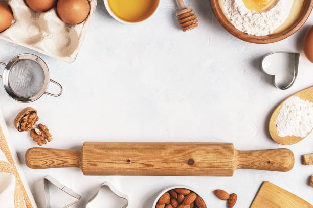istock Ingredients for baking  - flour, wooden spoon, rolling pin, eggs. 831294802
