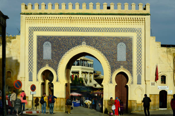 Morocco, Fes, Fes, Morocco - November 20th 2014: Unidentified people at Bab Boujeloud the entrance to souk Fes el-Bali bab boujeloud stock pictures, royalty-free photos & images