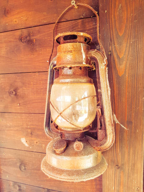 istock Old Lantern On Wooden Wall 831307636