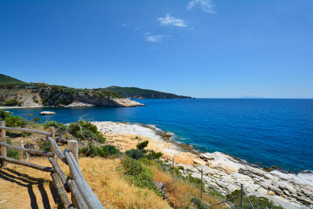 Greece, Thassos Island, Archaelogy Greece, Thassos Island, rocky coast at archeological site in Aliki and Samothrace Island in background archaelogy stock pictures, royalty-free photos & images