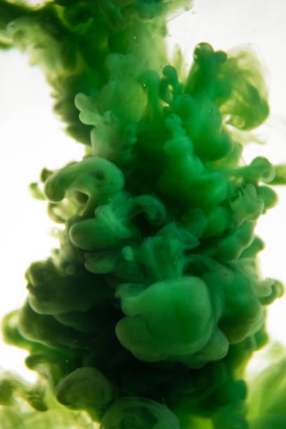 istock green ink in water isolated on white background 831311044