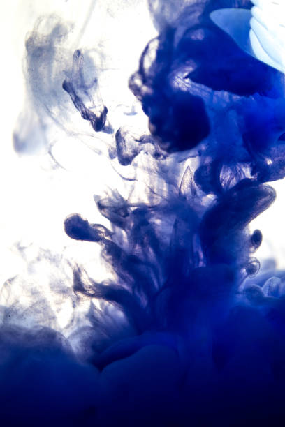 istock blue ink in water isolated on white background 831311918