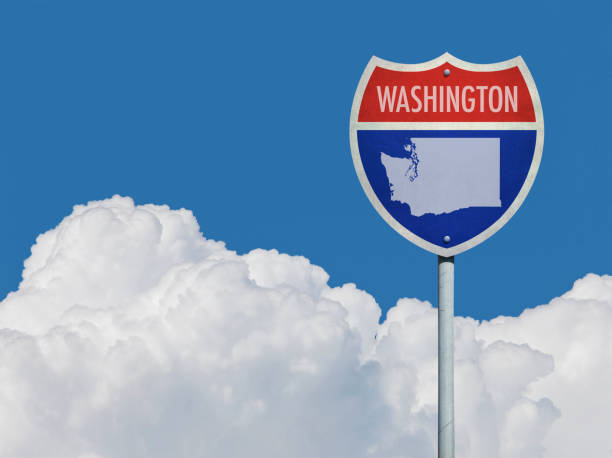 istock Highway sign for Interstate road in Washington with map in front of clouds 831318612