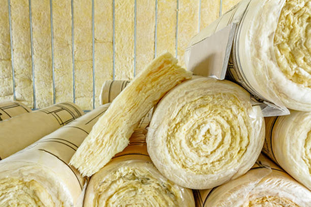 Stack of thermal insulation material in roll is wrapped with cellophane foil Package of thermal insulation material, rock wool is wrapped in foil. spiral rock stock pictures, royalty-free photos & images