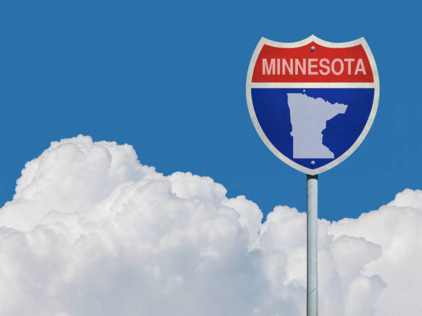 istock Highway sign for Interstate road Minnesota in front of clouds 831323178