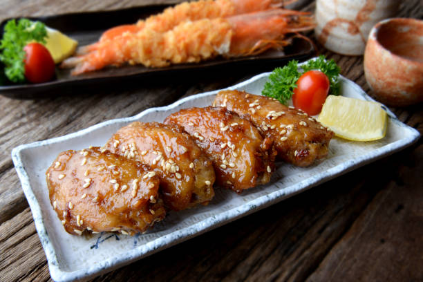 istock Fried chicken wing with spicy sauce in Japanese tebasaki style. 831326174