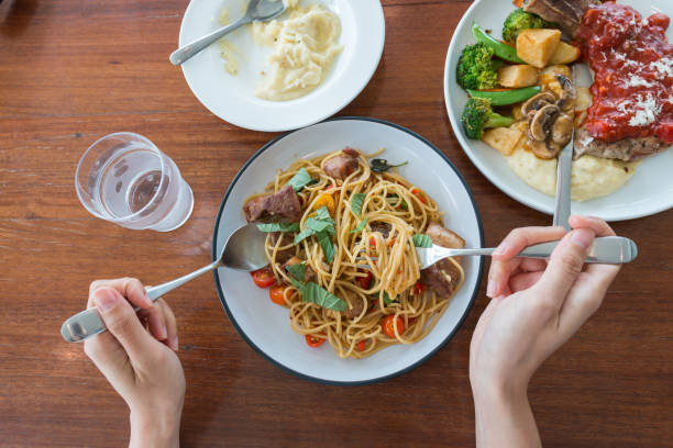 istock top view of a man enjoying a delicious meal 831342552