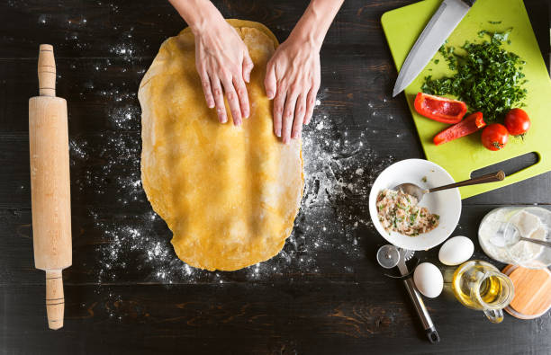istock Woman chef cooks step by step the traditional ravioli 831348256