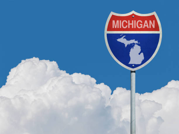 Highway sign for Interstate road in Michigan with map in front of clouds Highway sign for Interstate road in Michigan with map in front of clouds Michigan stock pictures, royalty-free photos & images