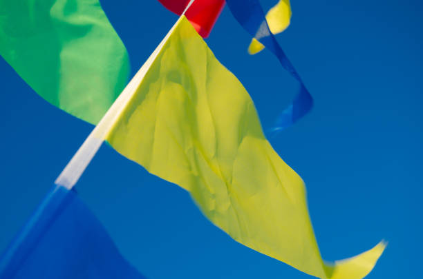 istock Dangling in the wind holiday flags 831360526