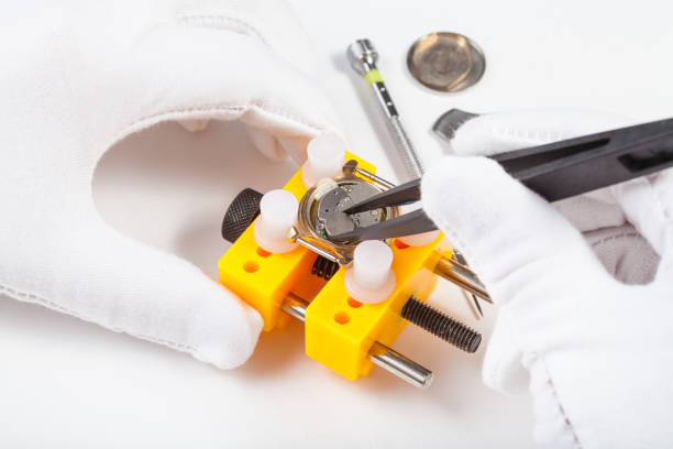 istock replacing a battery in quartz watch by tweezers 831363740
